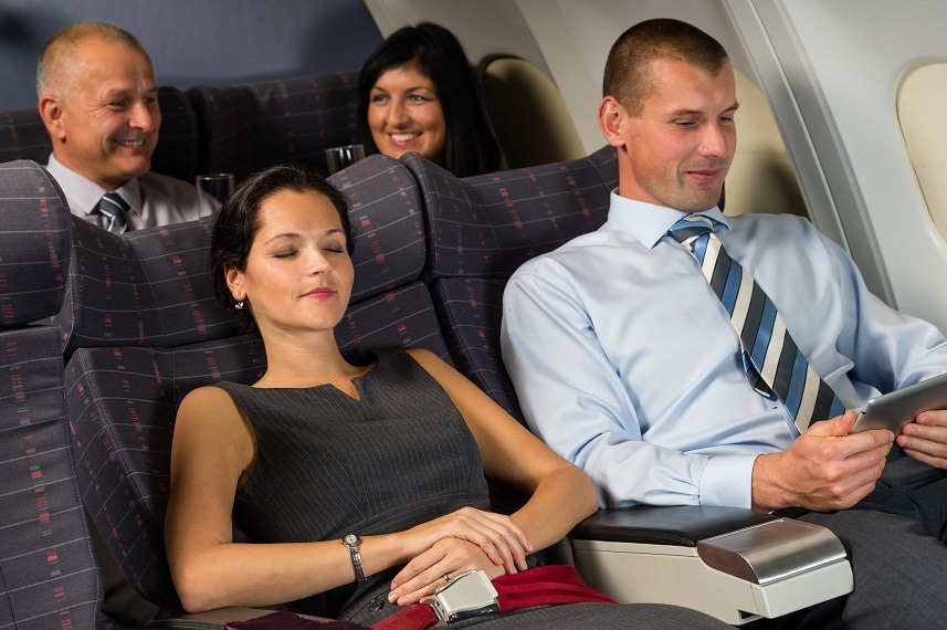Airplane passengers relax during flight