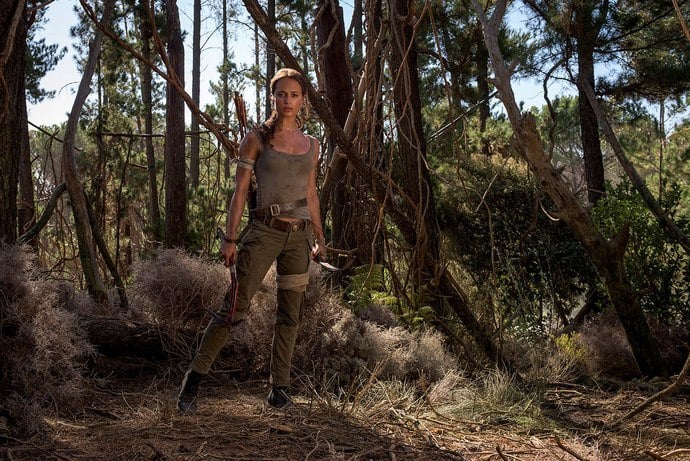 Alice Vikander's Lara Croft stands in a forest in the Tomb Raider reboot Alice Vikander's Lara Croft stands in a forest in the Tomb Raider reboot