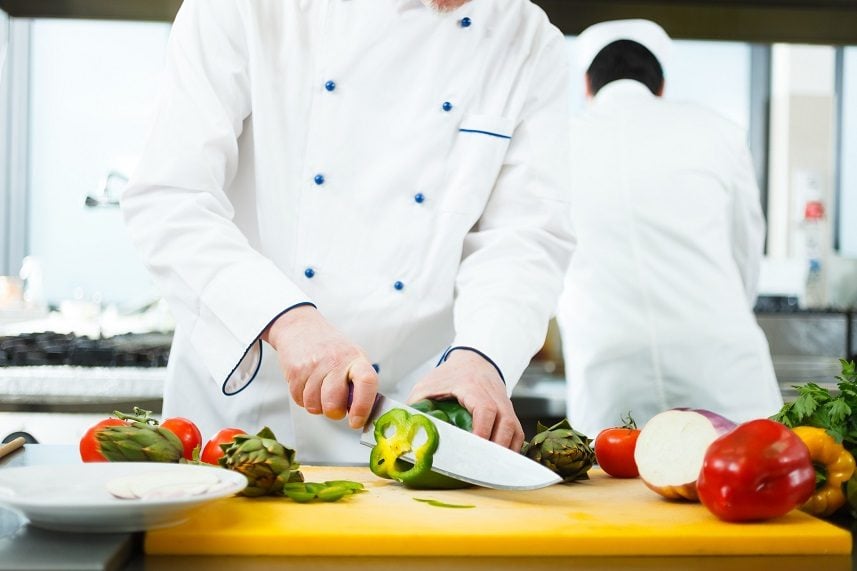 Friendly chef preparing vegetables