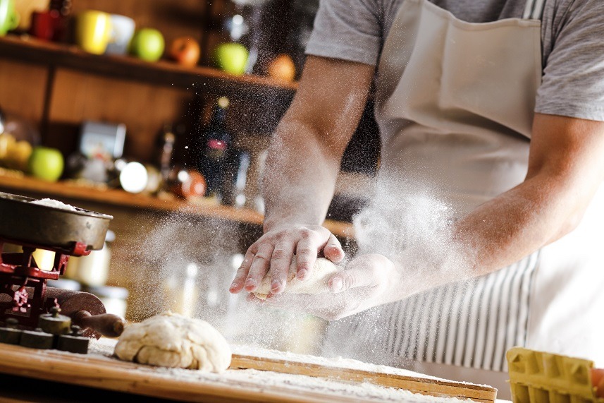 A baker prepares bread.
