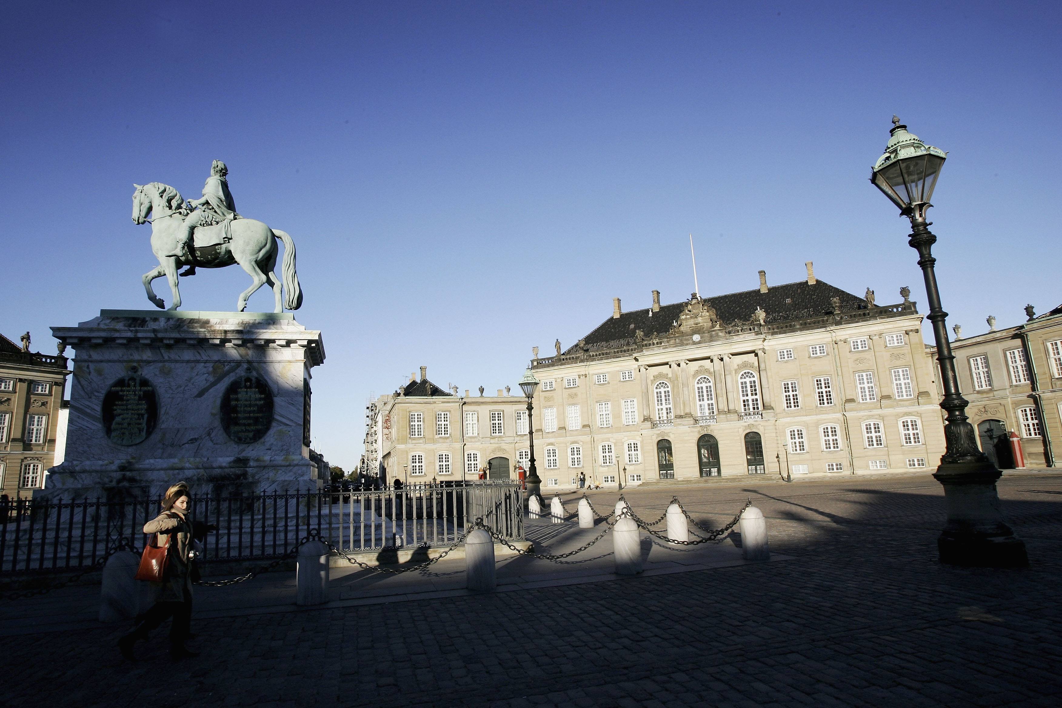 A statue of Fredrick V on Horseback is seen in the center of the Amalienborg Slot, home of the Danish Royal family