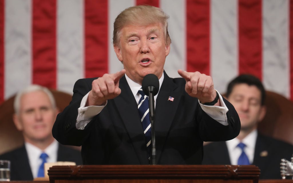 U.S. President Donald J. Trump (C) delivers his first address to a joint session of the U.S. Congress