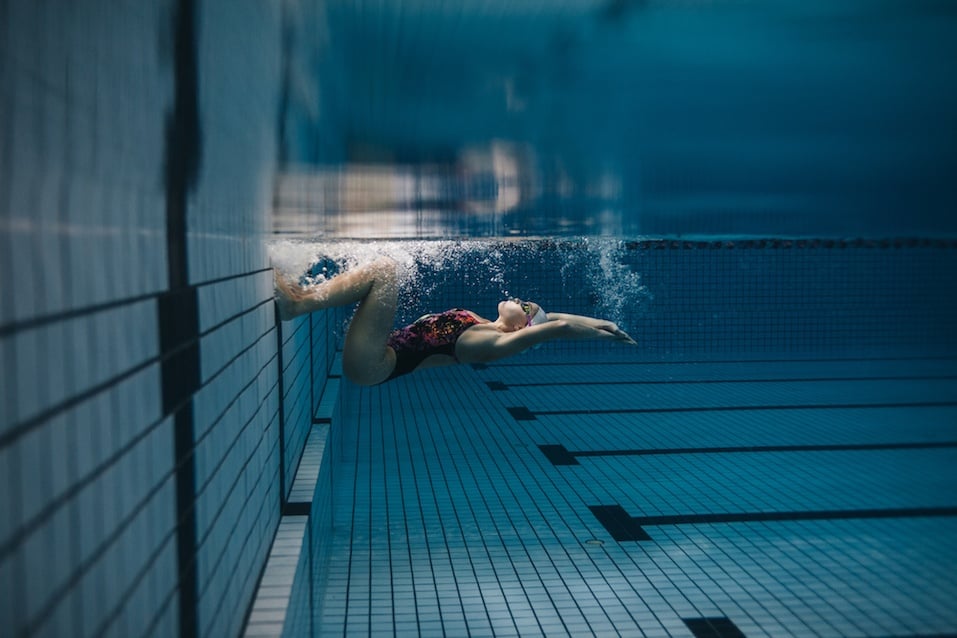 Swimmer in action inside swimming pool