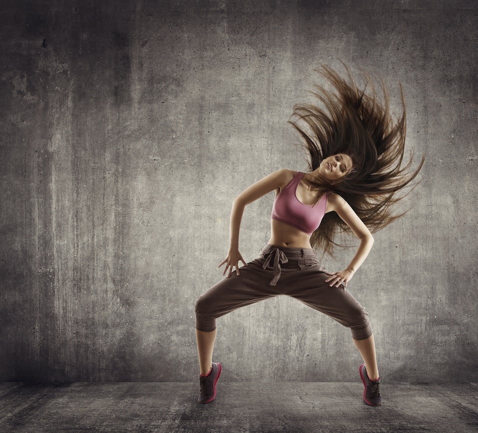 woman dancing in a ballet position woman dancing in a ballet position
