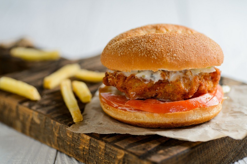 Chicken burger on wooden table