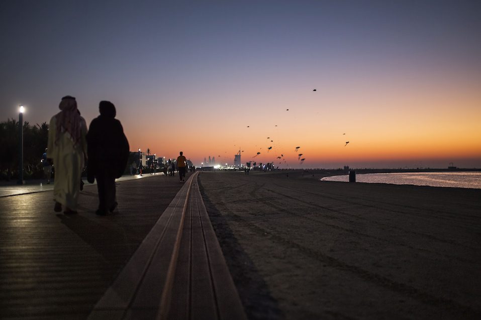 People on the running track along the beach in Dubai