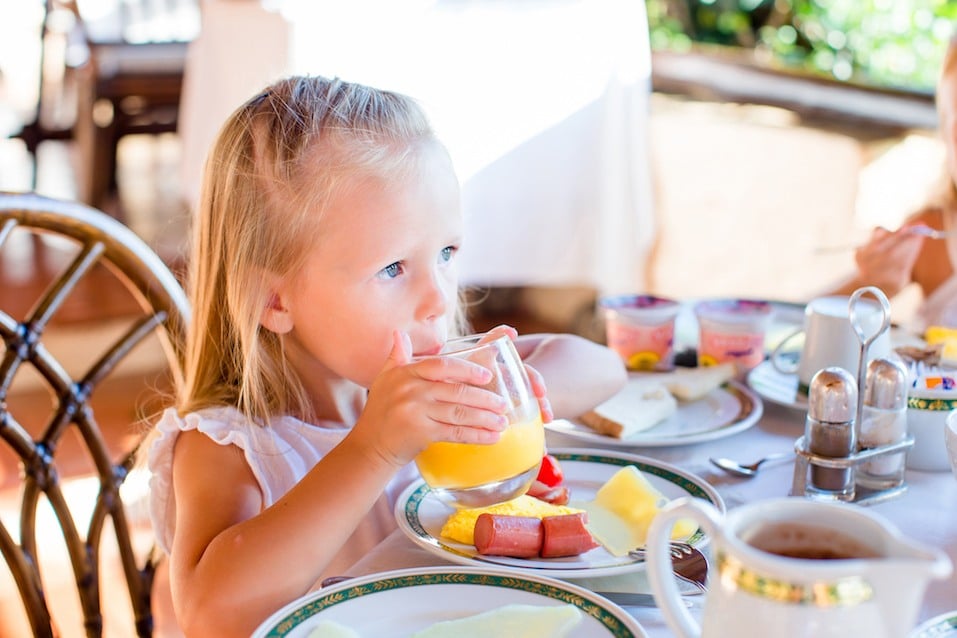 little girl eating breakfast