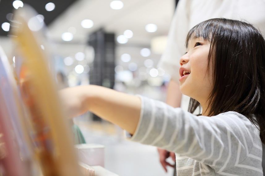 Girl doing shopping with her mother