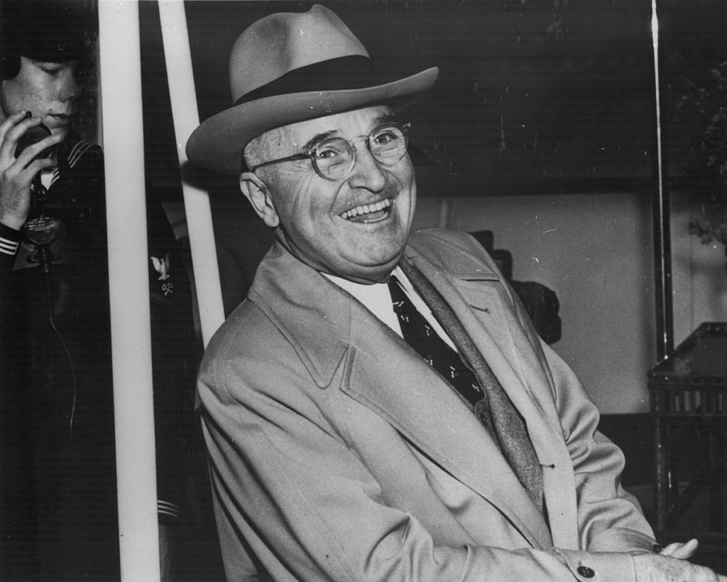 Harry S Truman President of the United States of America, laughing on board the 'Williamsburg', bound for Florida