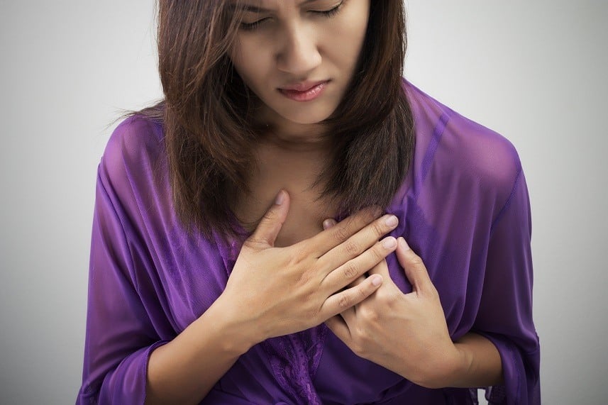 Woman having heart attack symptom