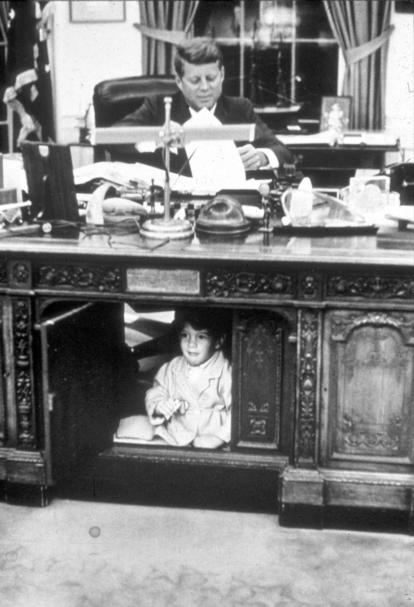 John Kennedy Jr. playing in the Oval Office at the White House