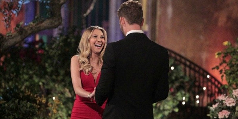 Lacey is smiling up at Nick on the first night of The Bachelor