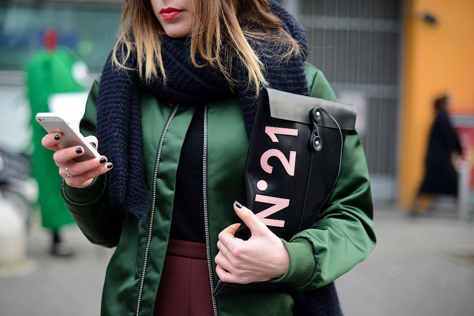 Giulia Capresi poses wearing an Acne bomber