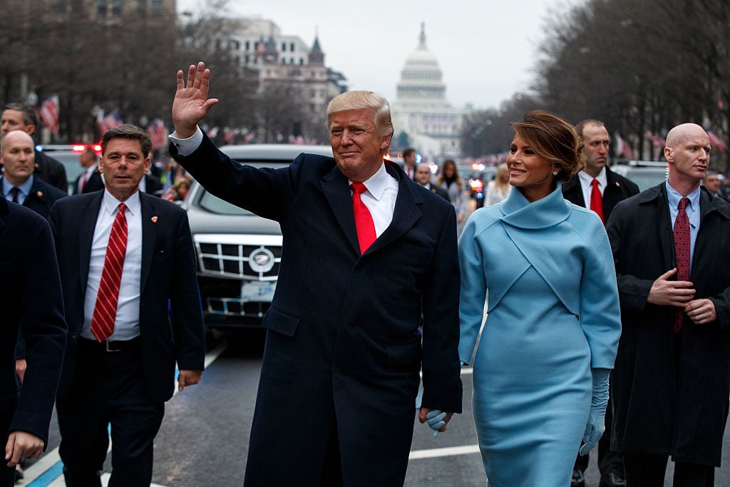 U.S. President Donald Trump waves to supporters with Melania Trump