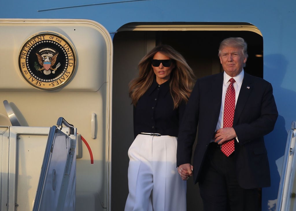Melania and Donald Trump exit Air Force One.
