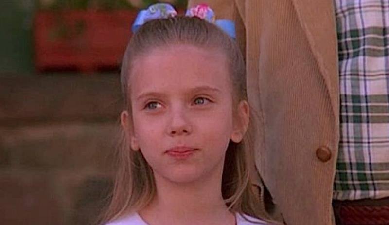 Scarlett Johansson as a little kid looking off.