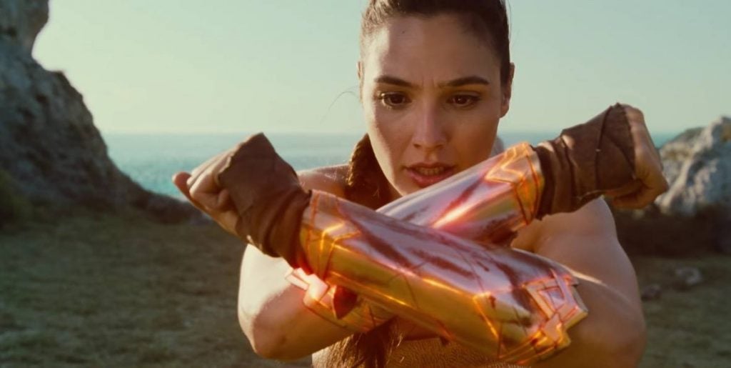 Gal Gadot as Wonder Woman crossing her arms in an x-formation Gal Gadot as Wonder Woman crossing her arms in an x-formation