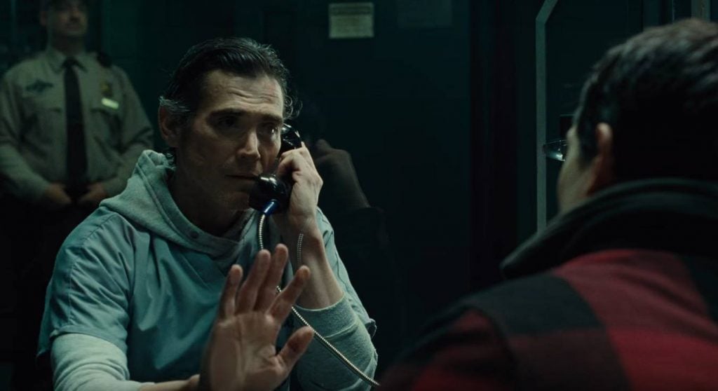 Billy Crudup as Henry Allen, putting his hand up against the glass as he talks to his son while in prison