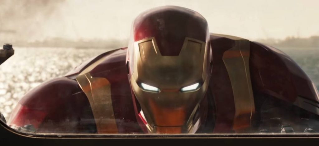 Iron Man looking through a window while helping stabilize a ship