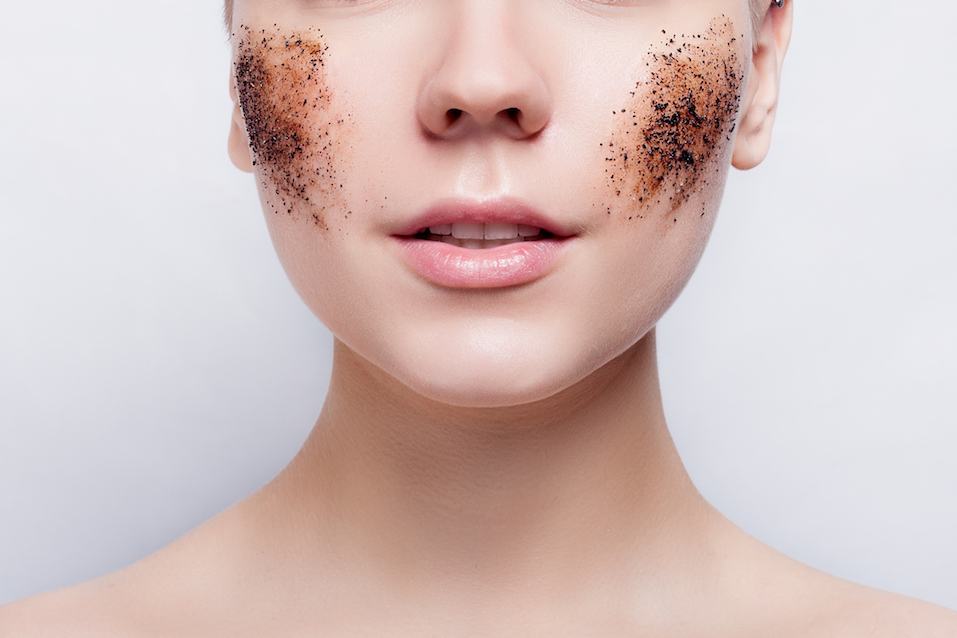 woman with a coffee scrub on her face