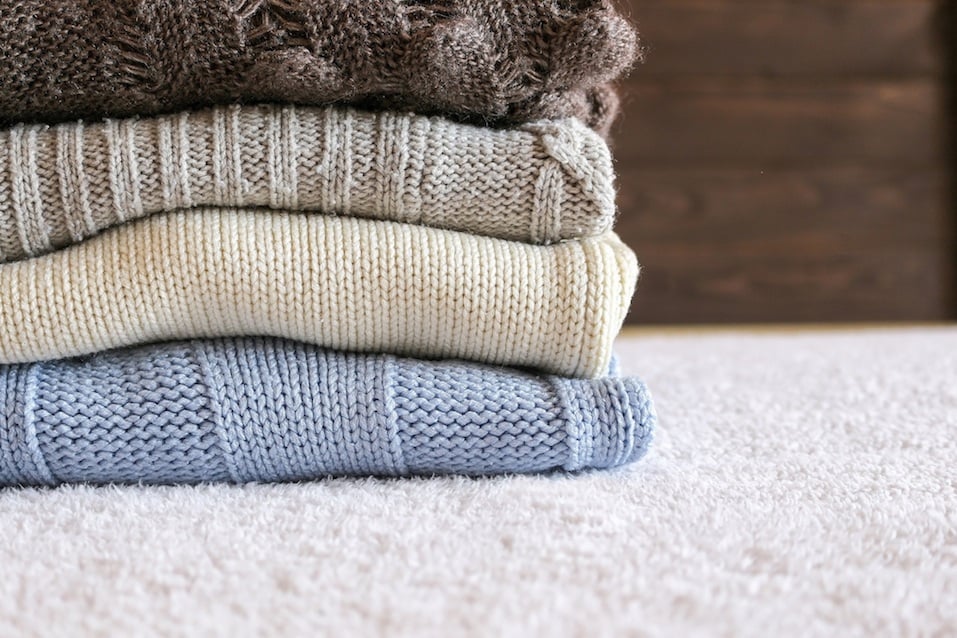 Stack of cozy knitted warm sweater