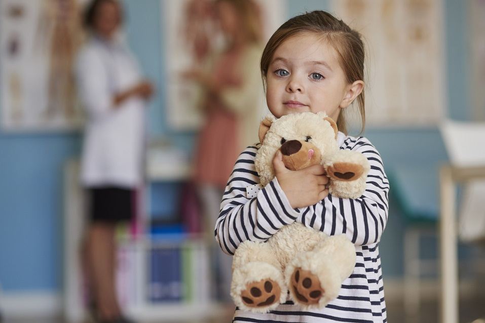 Small girl with toy