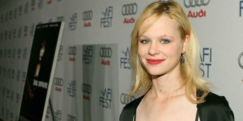 Thora Birch posing on the red carpet.