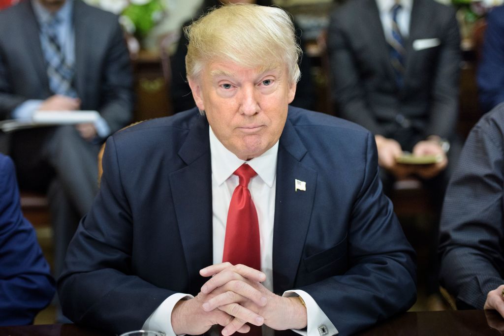 US President Donald Trump waits for a lunch meeting with Harley Davidson executives
