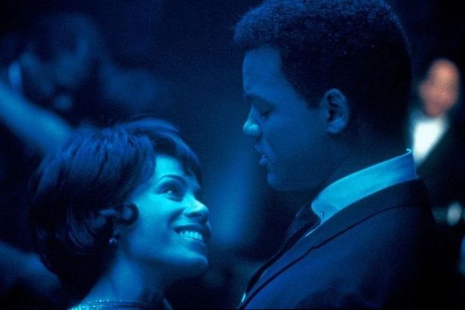 Will Smith and Jada Pinkett dancing together in blue lighting