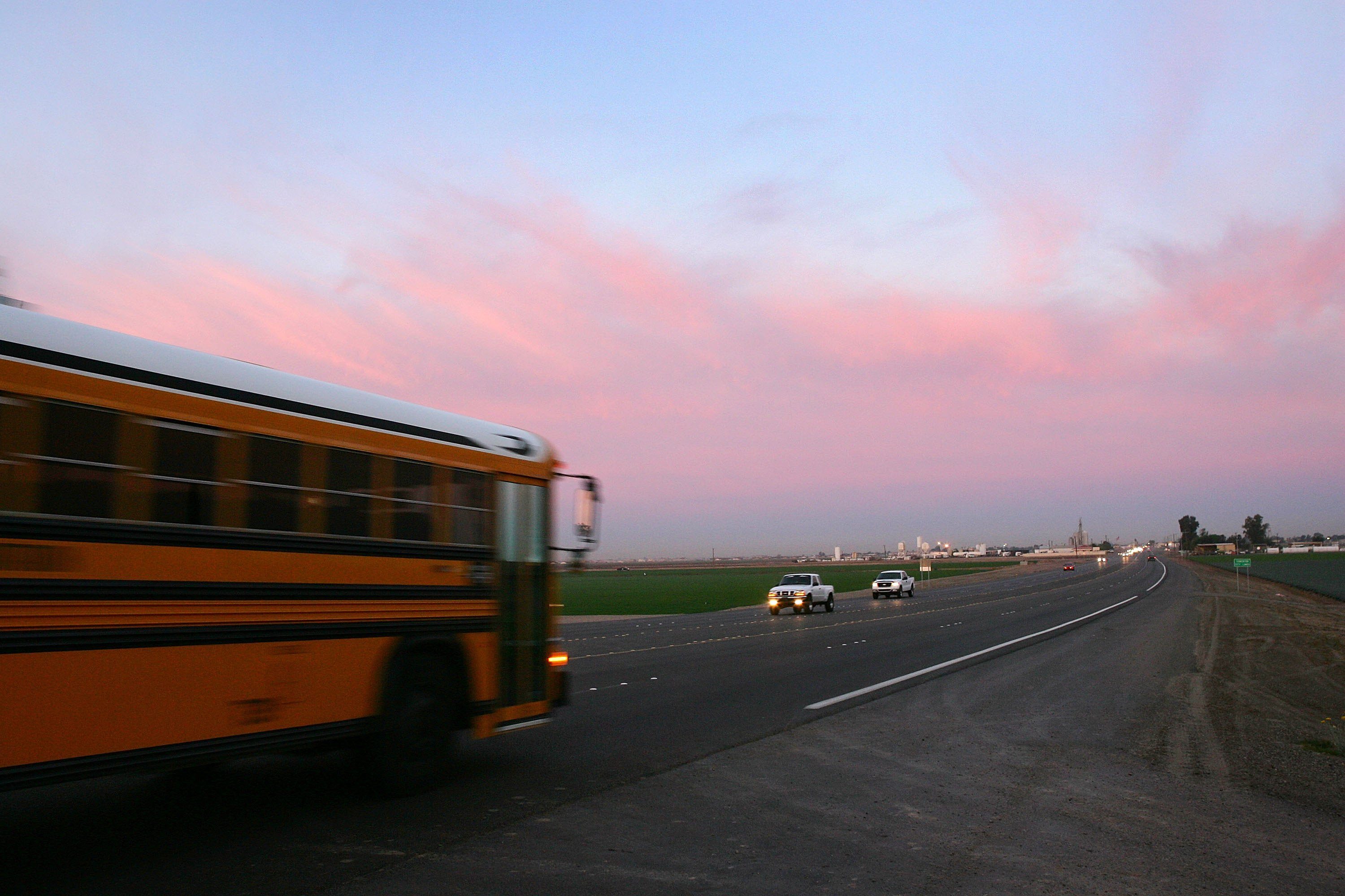 Pre-dawn traffic travels Highway 95 in Arizona
