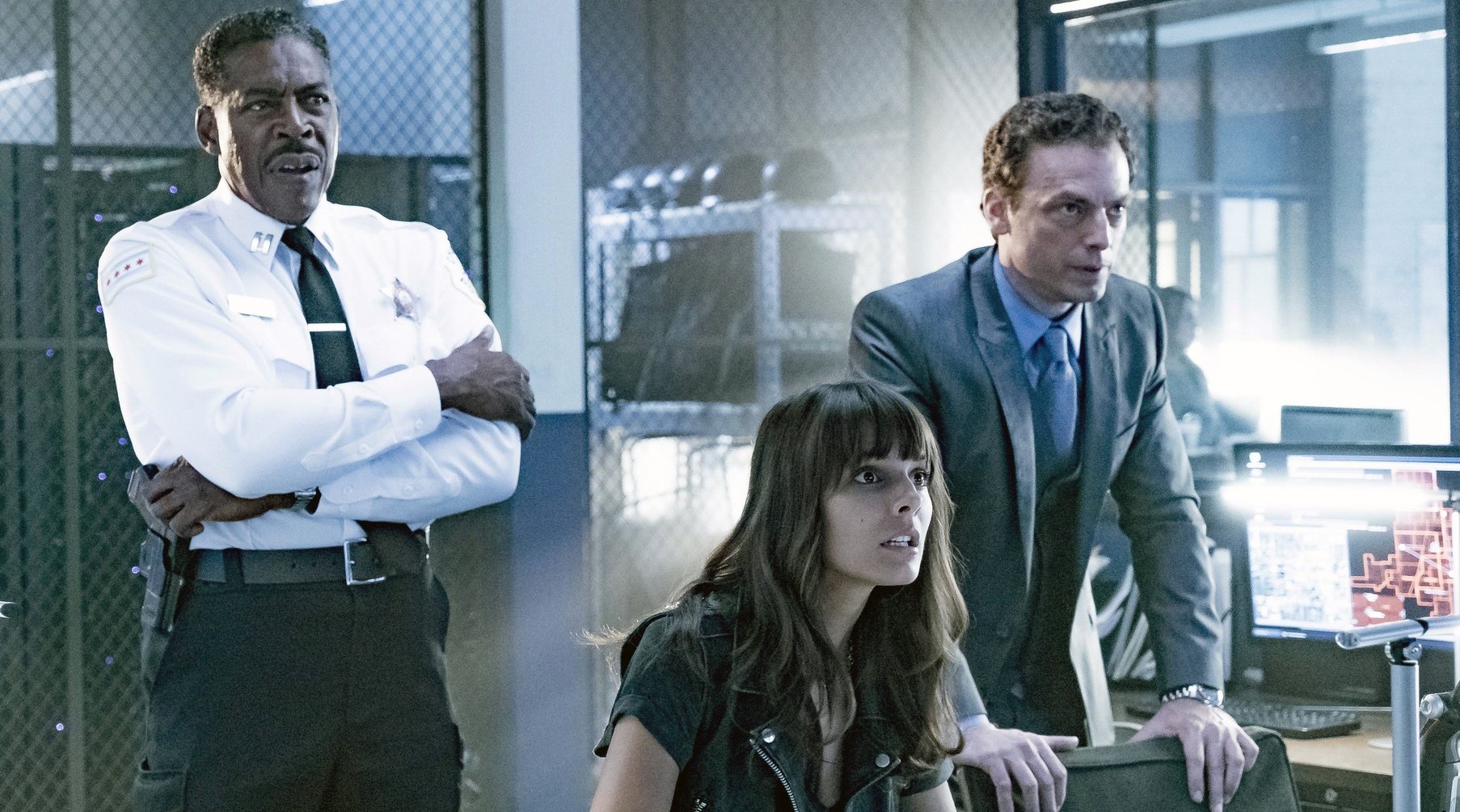 The cast of APB have a tense conference in a scene from the Fox show