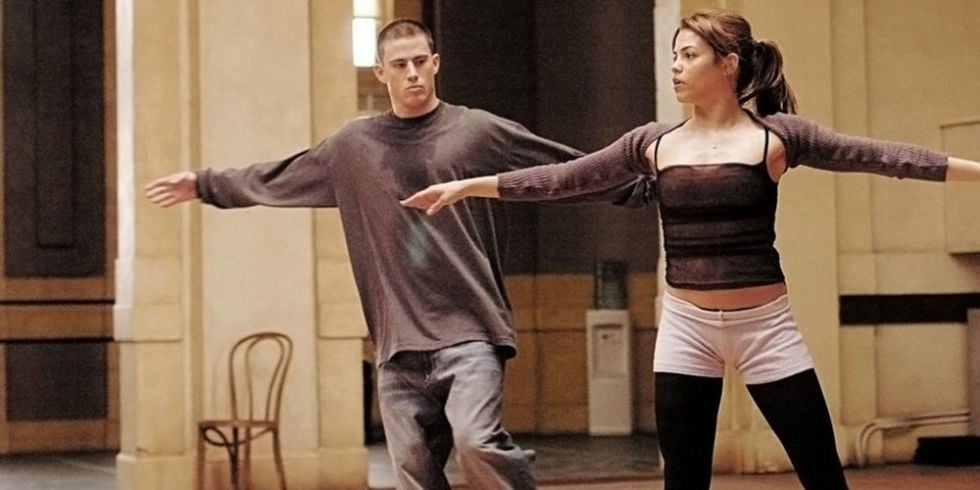 Channing Tatum with his arms out, dancing next to Jenna Dewan in Step Up
