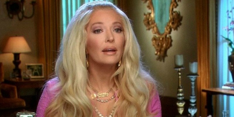 Erika Jayne sporting big hair and talking to the camera