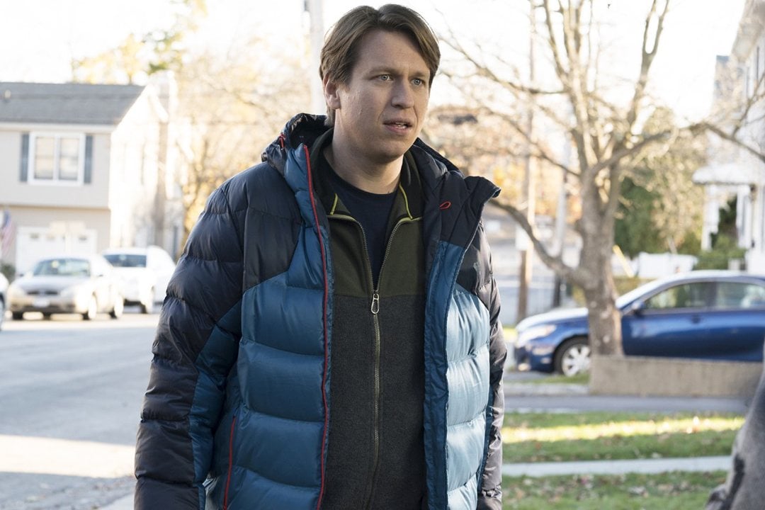 Peter Holmes stands outside in a scene from HBO's Crashing