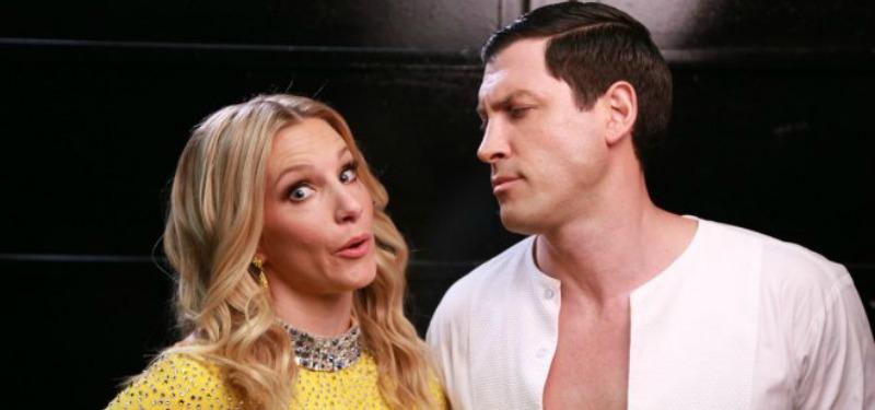 Heather Morris makes a funny face at the camera as Maks Chmerkovskiy looks at her.