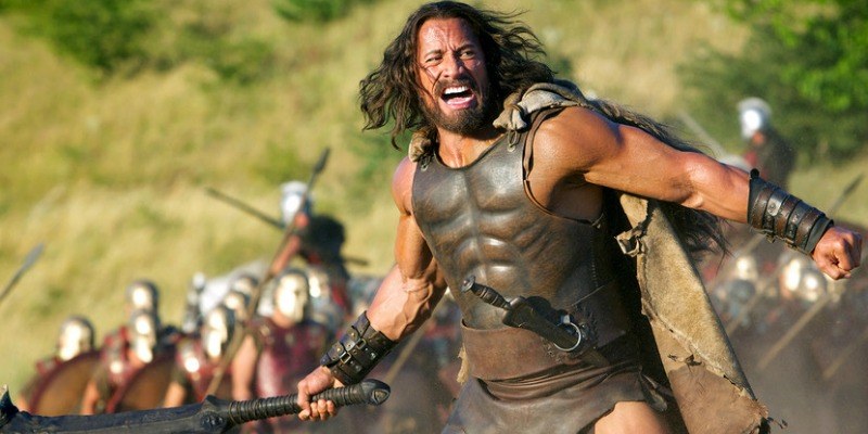 Hercules is swinging his weapon in the middle of a battle.