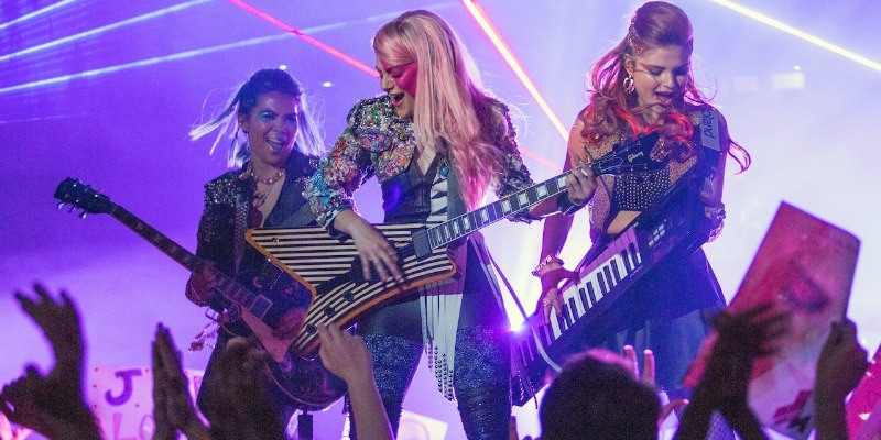 Jem and the Hologyams are performing on stage.
