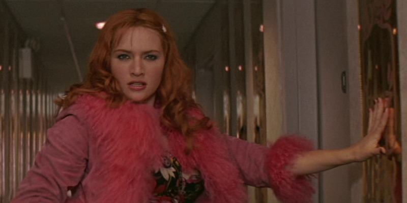 Kate Winslet posing in a hallway for Romance & Cigarettes