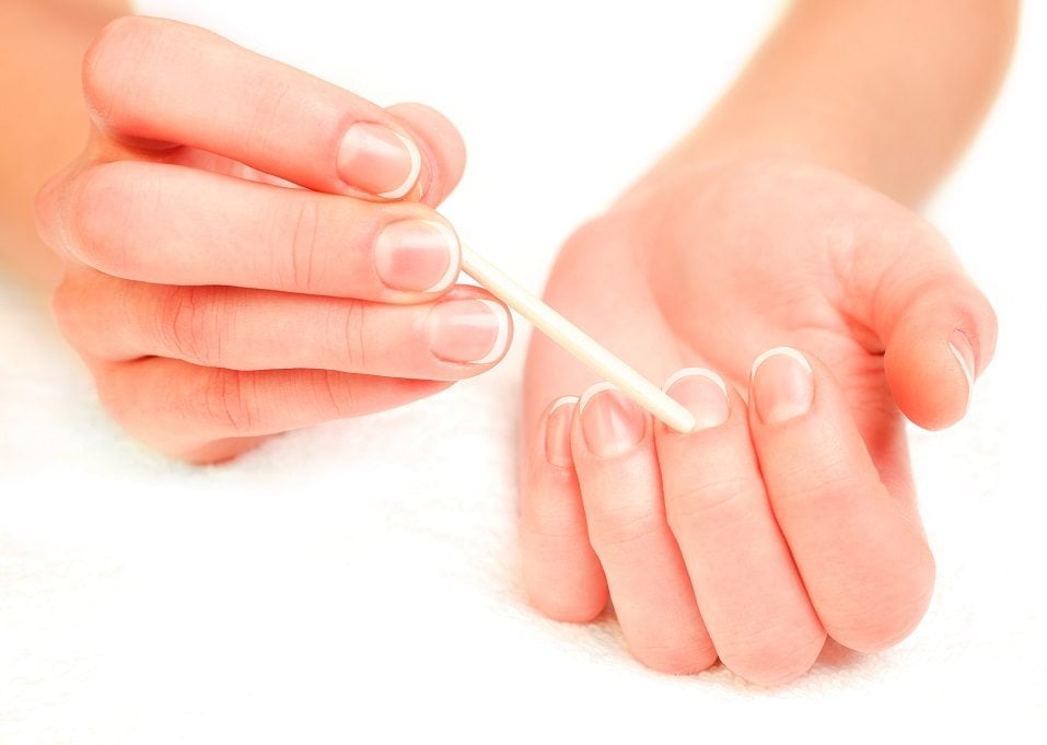 woman pushing cuticles