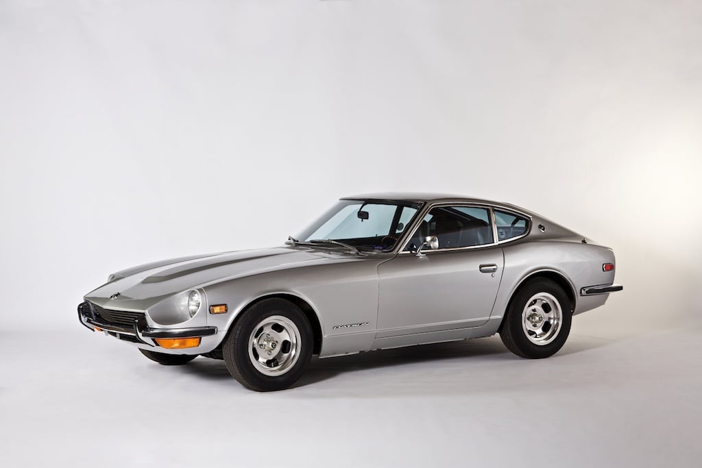 A silver 1971 Datsun 240Z on display.