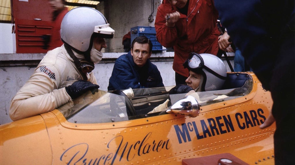 Bruce McLaren in a racing vehicle.