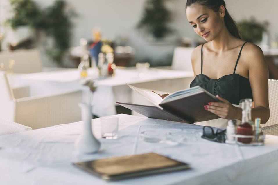 woman looking at menu