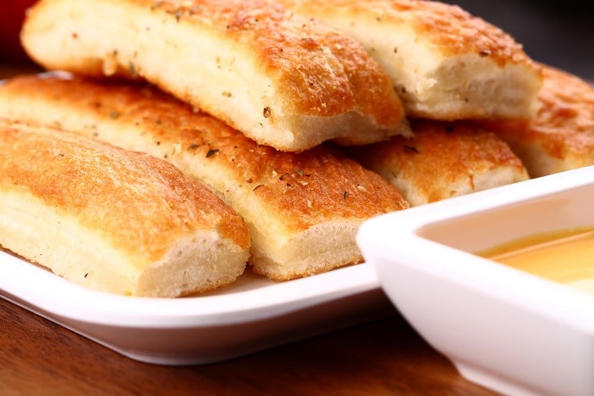 breadsticks served with dip sauce breadsticks served with dip sauce