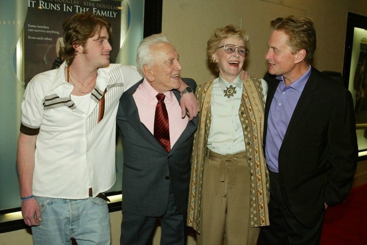 Cameron, Kirk, Diana, and Michael Douglas with their arms around each other at the premiere of 'It Runs In The Family'