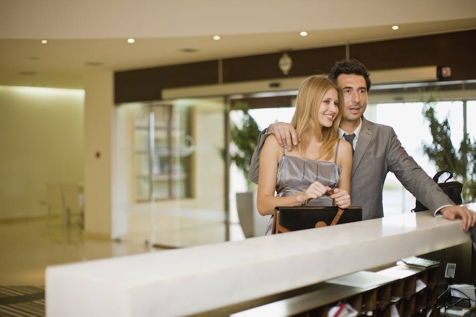 Couple standing on hotel reception