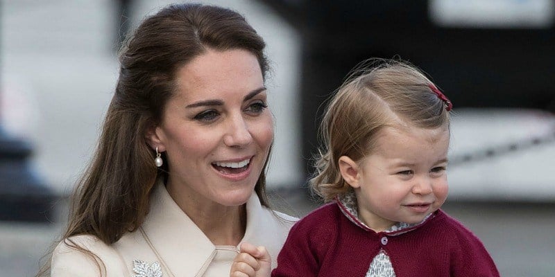 This is a closeup of Duchess Kate Middleton is holding Princess Charlotte. This is a closeup of Duchess Kate Middleton is holding Princess Charlotte.