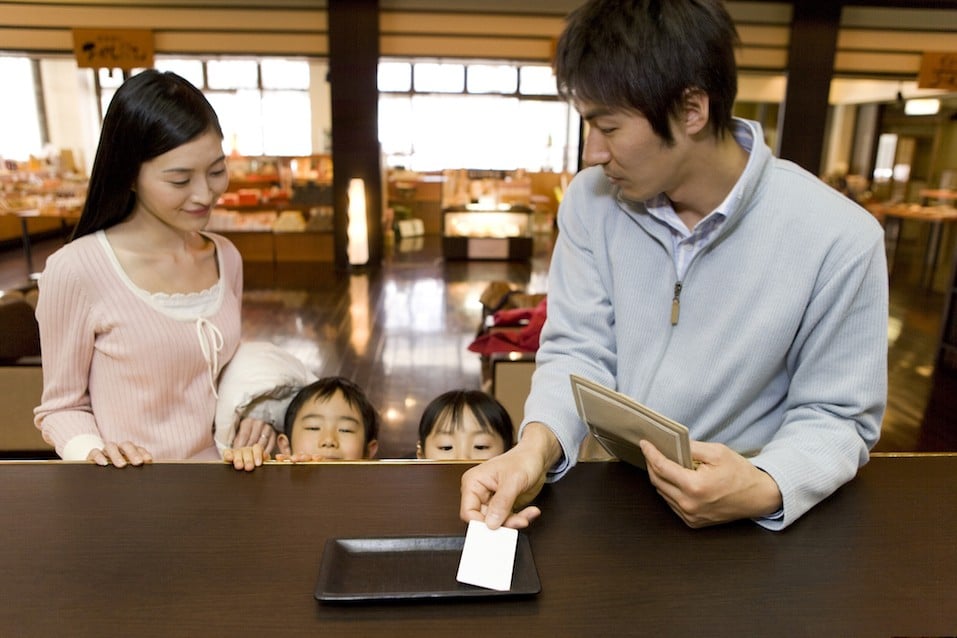 Family making payment from card