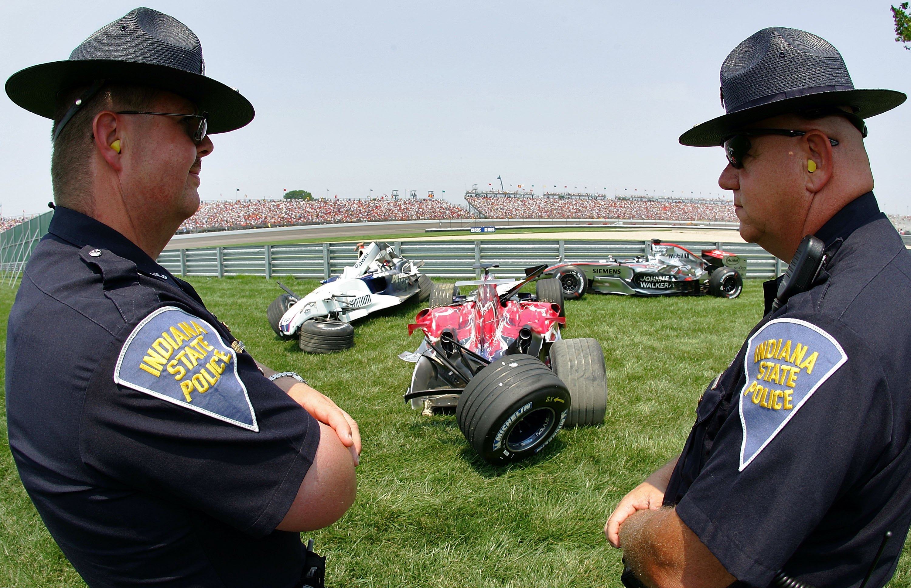 Indiana State Police look at wreckage after a crash