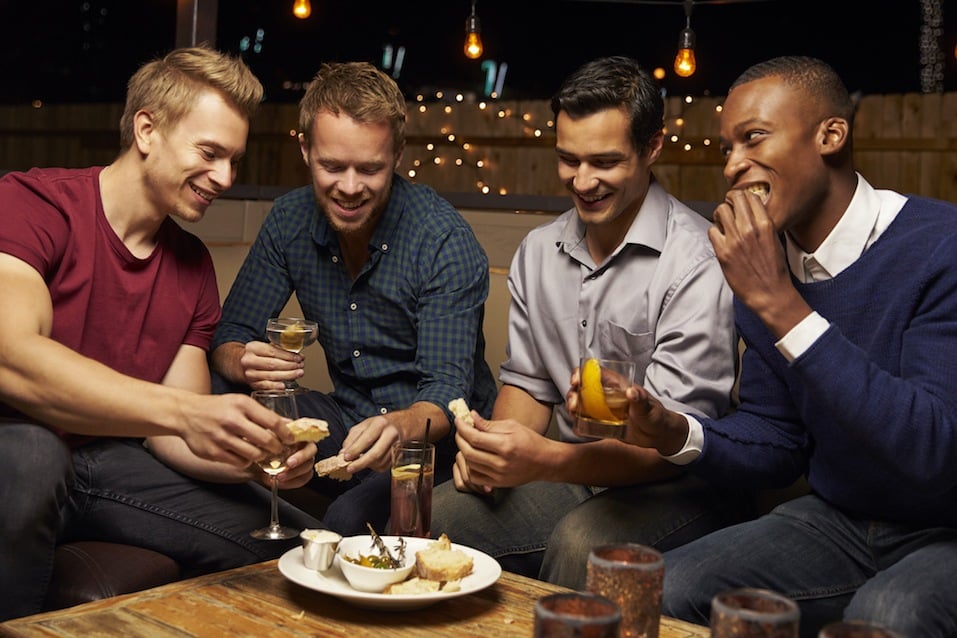 group of men enjoying drinks