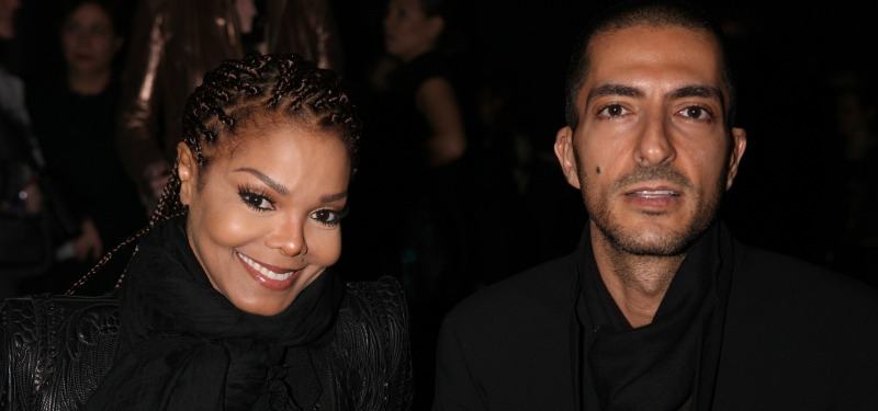 Janet Jackson and Wissam Al Mana wearing black smile at the camera